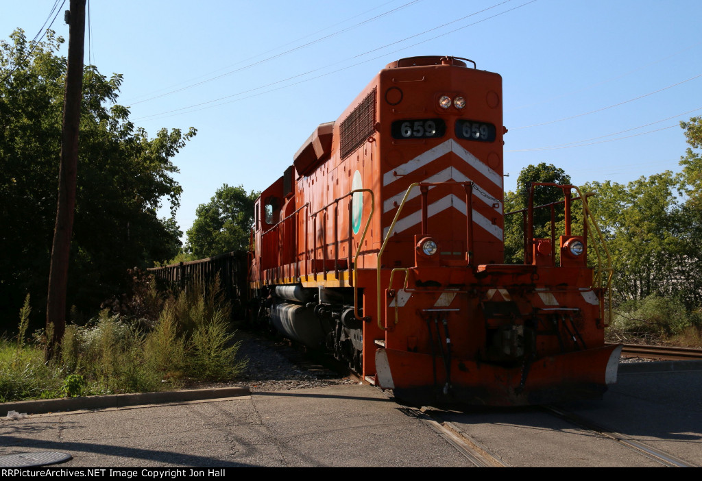 EJE 659 heads away in to the evening sun